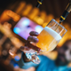 hand pouring beer from tap